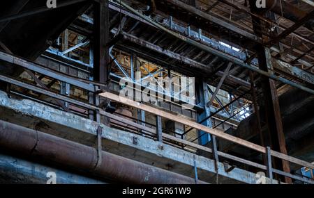 Low angle of an industrial building bacony with pipes Stock Photo