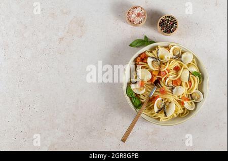 Traditional Italian seafood pasta with clams. Spaghetti alle Vongole.  Stock Photo