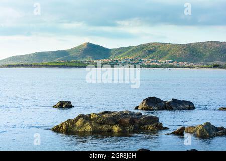 Sea, rocks and village of Budoni coastline, Sardinia, Italy Stock Photo