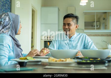 Eid Mubarak Celebration Moment, Malay Husband And Wife At The Dining ...