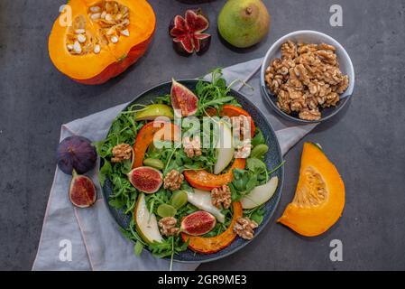 Autumn pumpkin salad and figs, pears and walnuts Stock Photo