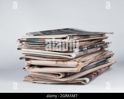 Pile of newspapers on white background. Journalist, isolated. Information. Stack Stock Photo