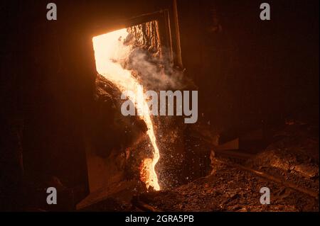 Discharge of liquid metal from a metallurgical furnace Stock Photo