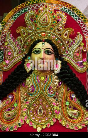 Goddess Durga idol at decorated Durga Puja pandal, shot at colored ...