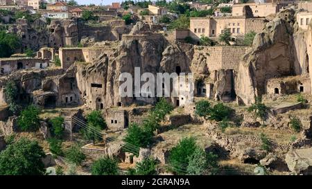 cliff dwelling in Turkey rock cut cave houses of Guzelyurt in central Anatolia Stock Photo