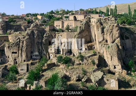 cliff dwelling in Turkey rock cut cave houses of Guzelyurt in central Anatolia Stock Photo