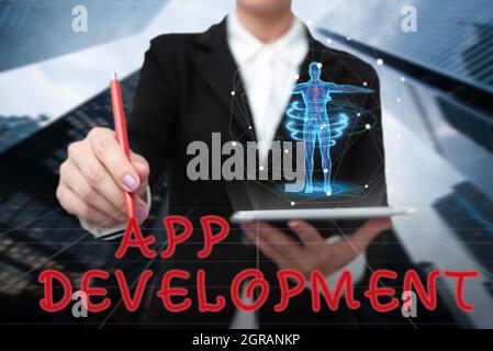 Sign displaying App Development. Business idea Development services for awesome mobile and web experiences Lady In Uniform Standing Holding Tablet Stock Photo