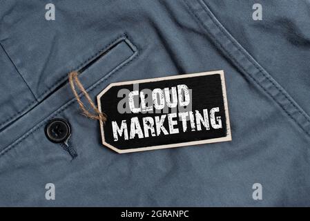 Hand writing sign Cloud Marketing. Word Written on The process of an organisation to market their services Collection of Blank Empty Sticker Tags Tied Stock Photo