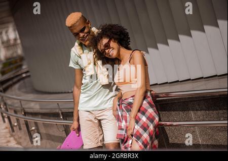 Young dark-skinned couple enjoying the day together Stock Photo