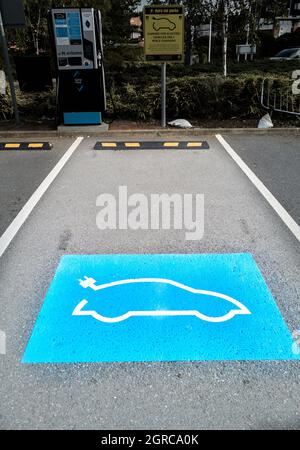Parking space and charging point for an electric vehicle. Stock Photo