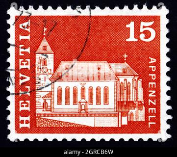 SWITZERLAND - CIRCA 1968: a stamp printed in the Switzerland shows St. Mauritius Church, Appenzell, circa 1968 Stock Photo