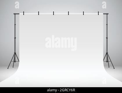White photo studio backdrop hanging on clips and tripods. Professional photo shooting setup standing on a grey background, realistic vector illustration. Stock Vector