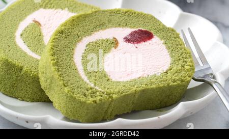 Delicious Matcha Swiss Roll Cake Slices With Strawberry Icing Cream On White Background Close Up Stock Photo Alamy