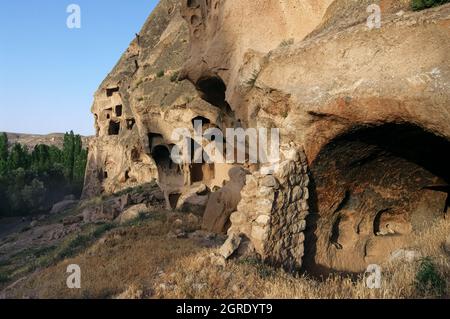 cliff dwelling in Turkey rock cut cave houses of Yaprakhisar in central Anatolia Stock Photo