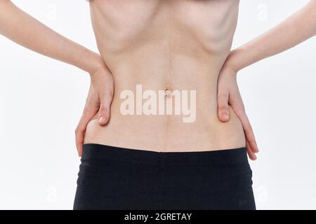 woman with flat stomach health problems anorexia weight loss Stock Photo