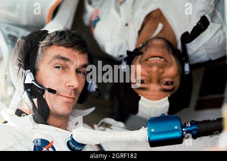 (7-19 Dec. 1972) --- Scientist-astronaut Harrison H. 'Jack' Schmitt, lunar module pilot, took this photograph of his two fellow crew men under zero-gravity conditions aboard the Apollo 17 spacecraft during the final lunar landing mission in NASA's Apollo program. That is astronaut Eugene A. Cernan, commander, who is seemingly 'right side up.' Astronaut Ronald E. Evans, command module pilot, appears to be 'upside down.' Stock Photo