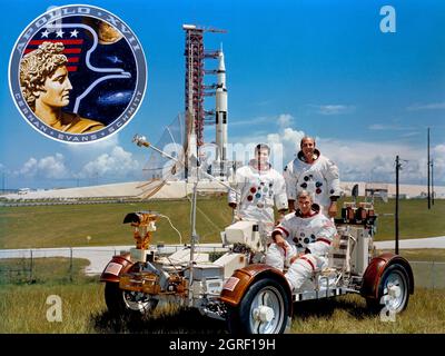 (September 1972) --- These three astronauts are the prime crew members of the Apollo 17 lunar landing mission. They are Eugene A. Cernan (seated), commander; Ronald E. Evans (standing on right), command module pilot; and Harrison H. Schmitt, lunar module pilot. They are photographed with a Lunar Roving Vehicle (LRV) trainer. Cernan and Schmitt will use an LRV during their exploration of the Taurus-Littrow landing site. The Apollo 17 Saturn V space vehicle is in the background. This picture was taken at Pad A, Launch Complex 39, Kennedy Space Center (KSC), Florida. The Apollo 17 insignia is in Stock Photo