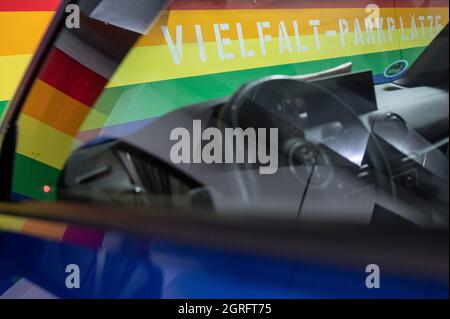 Hanau, Germany. 01st Oct, 2021. A car is parked in one of the 'diversity parking spaces' in the Am Markt underground car park. The three parking spaces, which are video-monitored and close to exits, were set up last week. They are marked by the rainbow colours on the wall. Credit: Sebastian Gollnow/dpa/Alamy Live News Stock Photo