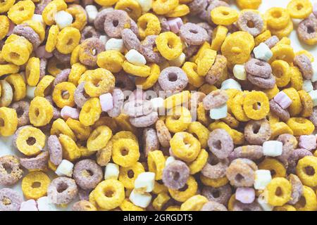 Multi colored cereal fruit loops background. Close up. Breakfast concept Stock Photo