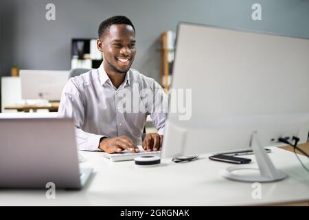 Happy Professional Man Employee Using Computer For Work Stock Photo