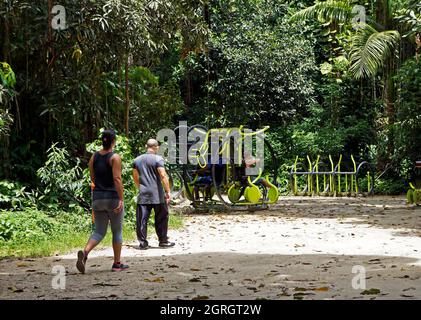 RIO DE JANEIRO, BRAZIL - DECEMBER 21, 2019: People in gym area at 'Bosque da Freguesia' Public park in the neighborhood of Jacarepagua Stock Photo