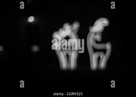 Defocused decoration LED lights for the Holiday season in the shape of raindeer against black night background Stock Photo