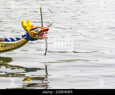 Colorful Carved Dragon Head On The Front Part Of A Dragon Boat At The Dragon Boat Race