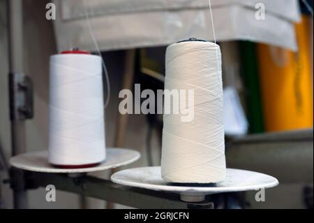 White threads of the sewing machine Stock Photo