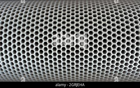 Pentagonal perforated metal surface Stock Photo