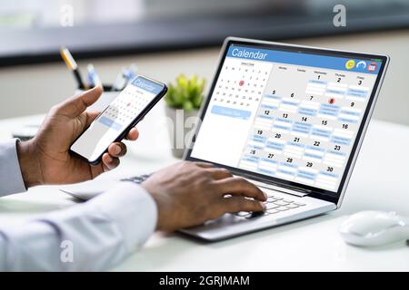 African American Doing Calendar Schedule Planning. Business Agenda In Office Stock Photo