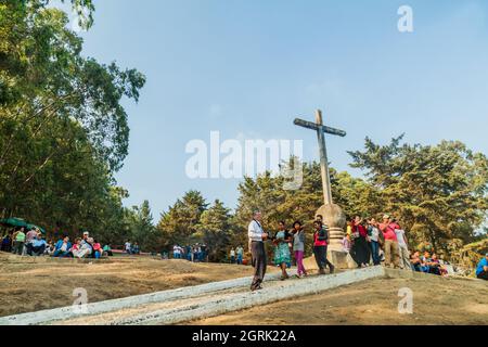 ANTIGUA, GUATEMALA - MARCH 27, 2016: People at the Cerro de la Cruz viewpoint in Antigua, Guatemala Stock Photo