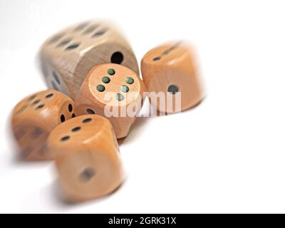 Wooden game dice against a white background Stock Photo