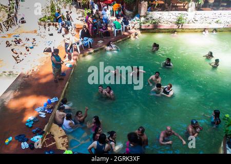 FUENTES GEORGINAS, GUATEMALA - MARCH 22, 2016: People bathing in a thermal pool Funtes Georginas. Stock Photo