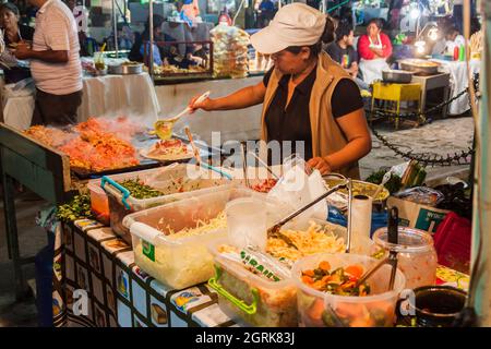 ANTIGUA, GUATEMALA - MARCH 26, 2016: Food stall at a market in Antigua Guatemala town, Guatemala. Stock Photo
