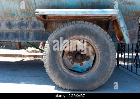 Old vehicle, scrap vehicle, worn tire, backhoe loader Stock Photo