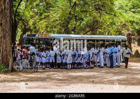 POLONNARUWA, SRI LANKA - JULY 22, 2016: Children in school uniforms visit ancient city Polonnaruwa, Sri Lanka Stock Photo