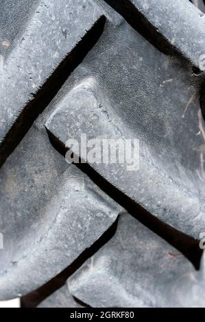 Old vehicle, scrap vehicle, worn tire, backhoe loader Stock Photo