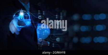 Engineer businessman hand pushing start icon on modern computer for programming about cyber security,advance virtual network future technology Stock Photo