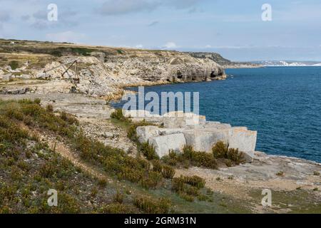 Portland stone along the rocky quarried coastline at Portland Bill, Isle of Portland, Dorset, England, UK Stock Photo