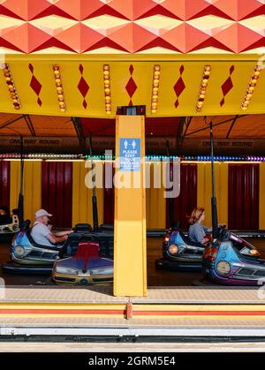 A social distancing covid keep 2 metres apart at a fairground bumper car ride in Great Yarmouth seaside resort town on the Norfolk coast England. Stock Photo