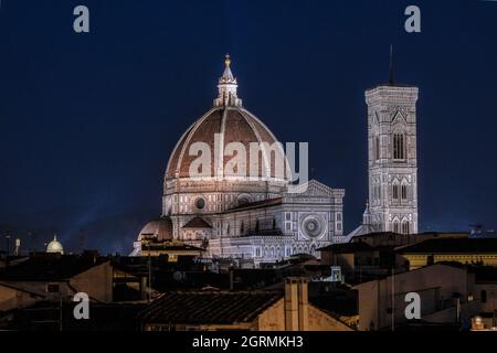 Night view of the Duomo and Giotto's bell tower from the rooftops of Florence Stock Photo