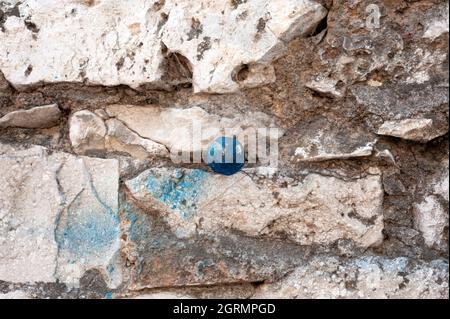 Screw, nail in the wall. Stock Photo