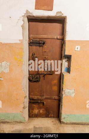 Rusty door in an old prison Stock Photo