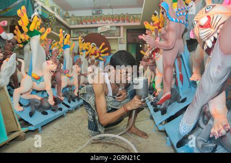 Sylhet, Bangladesh. 1st October 2021. Artist Nondi Paul, of Dariya Para Sylhet, is seen painting sculptures of Goddess Durga Idols in preparation for the upcoming traditional Hindu religious Durga Puja festival. Credit: Majority World CIC/Alamy Live News Stock Photo