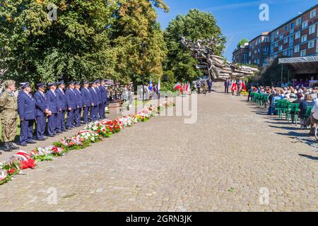 GDANSK, POLAND - SEPTEMBER 1, 2016: Commemorating of Defence of the Polish Post Office on September 1, 1939. Monument to the Defenders in the backgrou Stock Photo