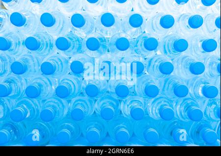 Plastic bottles and blue caps Stock Photo