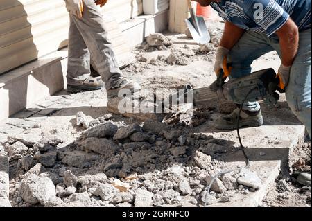 The sidewalk workers are working Stock Photo
