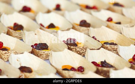 Cooking demonstration, table with food portions on display. Stock Photo