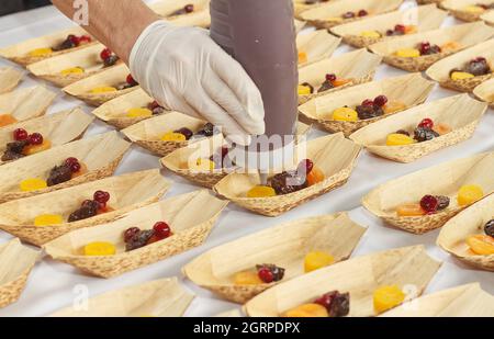 Cooking demonstration, table with food portions on display. Stock Photo