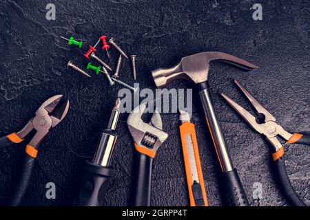 Many different tools for repair work on a black background Stock Photo